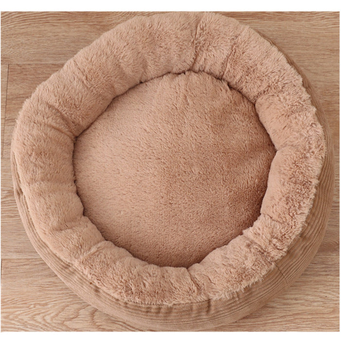 Beige pet bed on a wooden surface