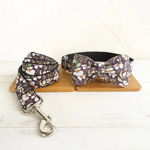 Floral-patterned dog collar and leash set on a wooden board with a white background