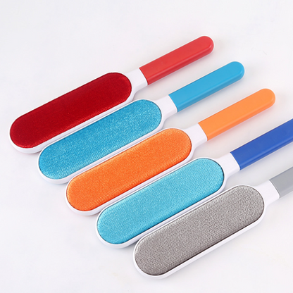 Set of five pet grooming brushes with different colored bristle designs on a white background
