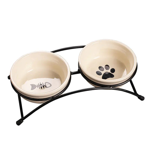 Pet bowls with a black metal stand on a white background