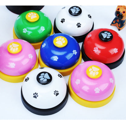 Colorful dog training bells with paw prints on a white background